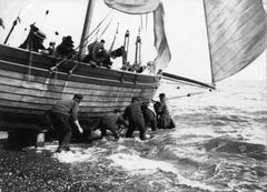 Pleasure boat coming ashore c1890